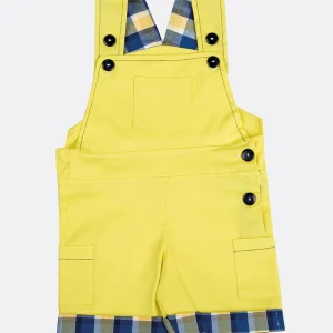 Salopette in cotone tinta unita con contrasto a quadri sui risvolti