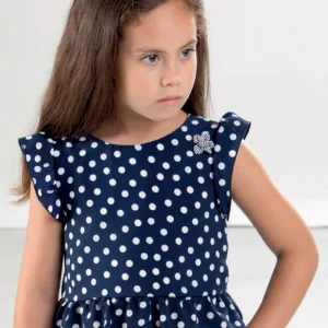 Blusa crepe a pois con balza ed alette arricciate, applicazione e retro con scollatura a “v” e fiocco applicato